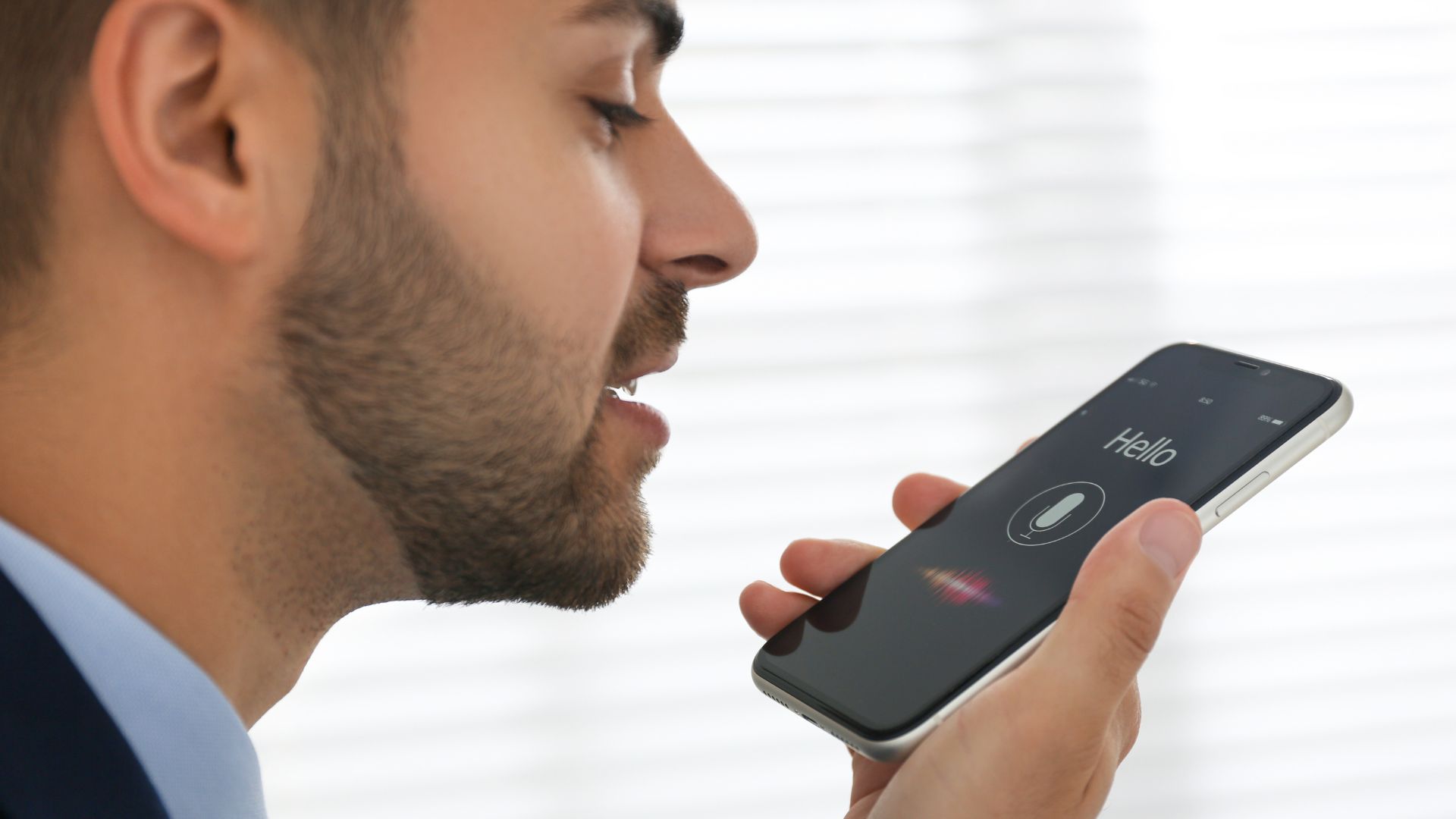 Person using voice search on smartphone – voice search optimization 2026