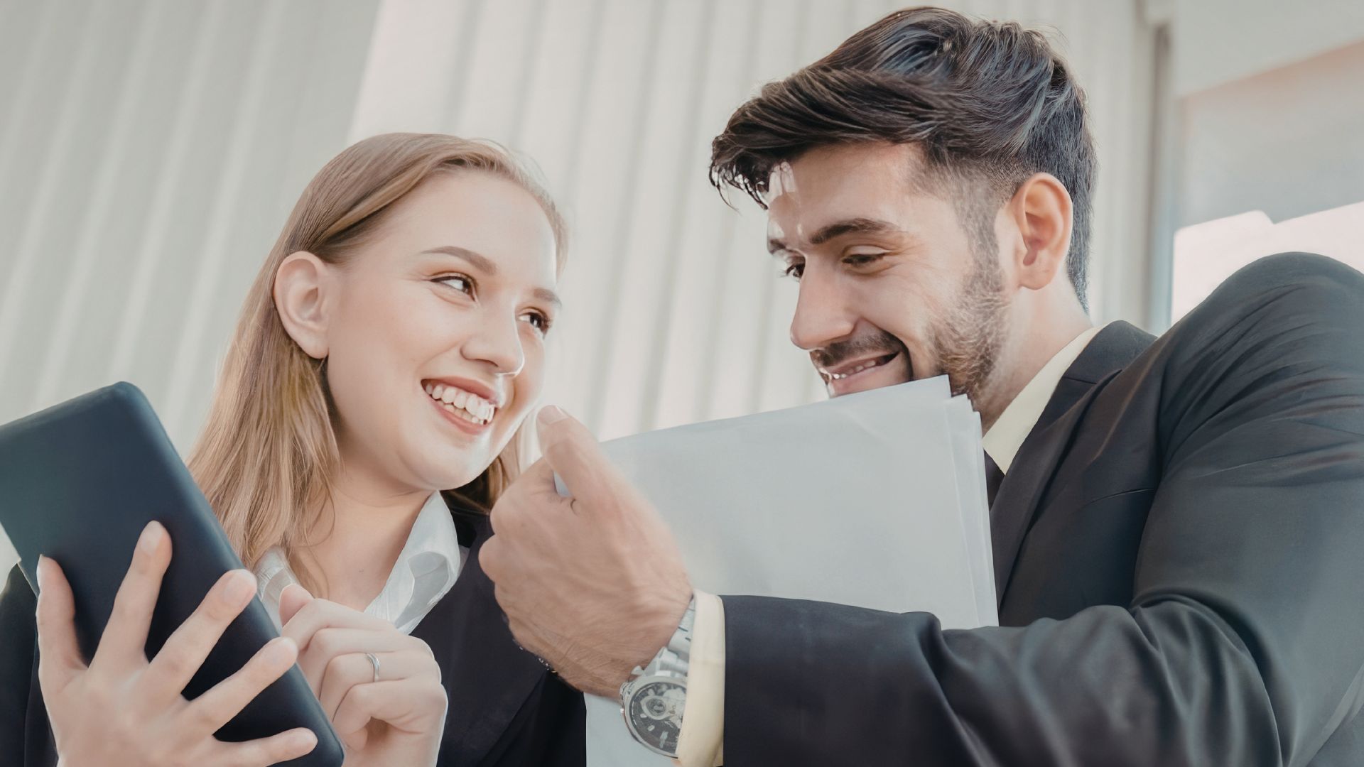 Business owner reviewing benefits of AI receptionist on tablet