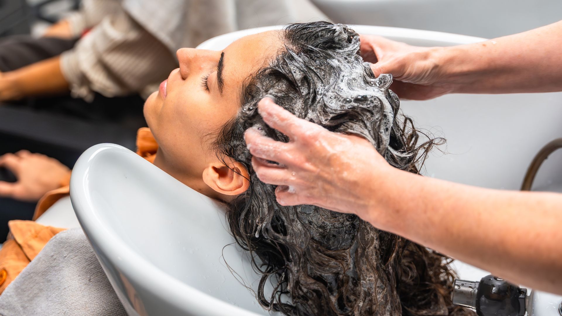 Hair salon reception with AI booking tablet